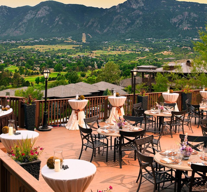 a large patio decorated with seating for an event