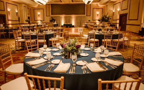 Internal view of an elegant venue decorated for a wedding reception
