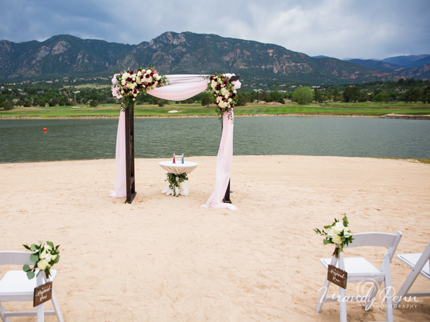 A wedding setup next to a lake 