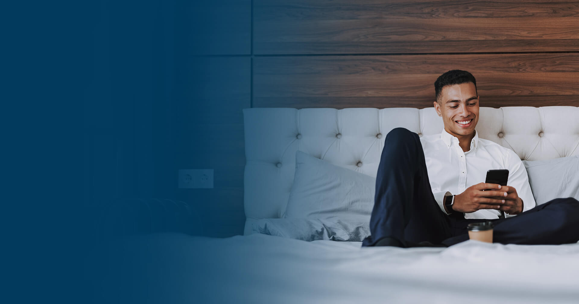 man sitting on bed