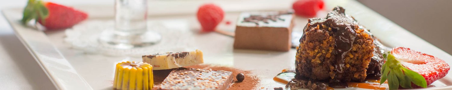 Selection of desserts on white plate