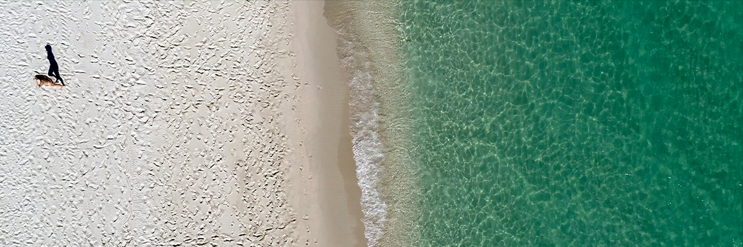 miami beach aerial of clear blue water and white sand