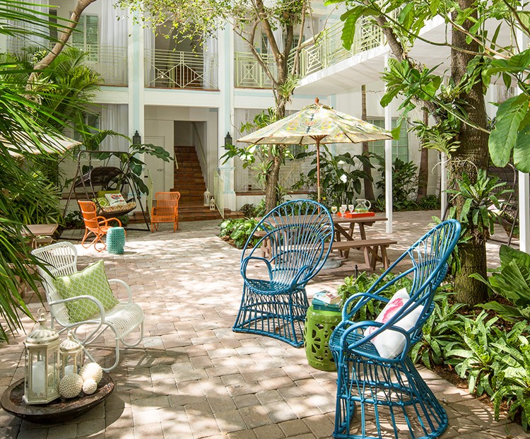 wundergarden courtyard of colorful seating surrounded by lush plants
