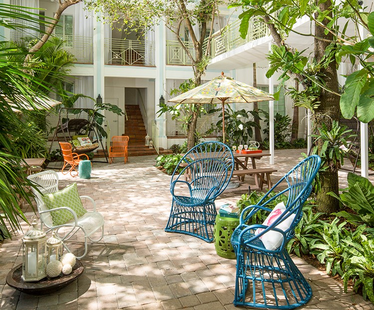 wundergarden courtyard of colorful seating surrounded by lush plants