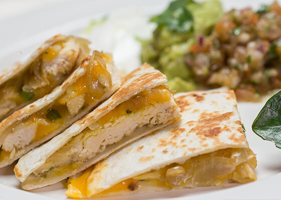 Chicken quesadillas with salad on plate
