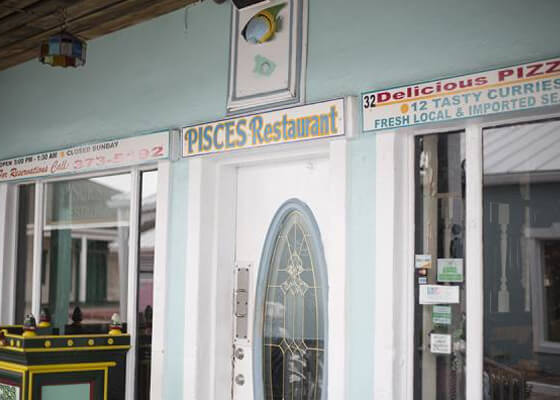 Pisces restaurant entrance with white door
