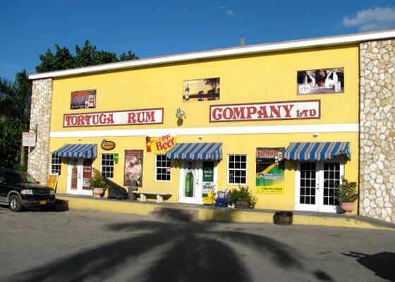 Tortuga Rum yellow building with white door
