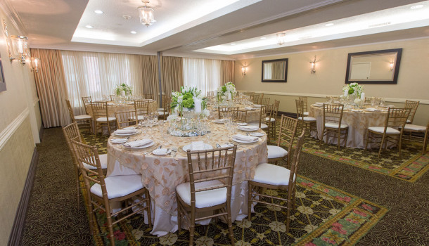 Round tables set up with white chairs