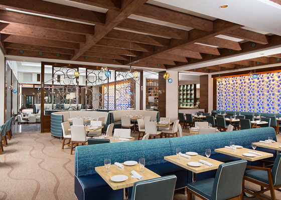 Restaurant Dining room with aqua colored booth seating