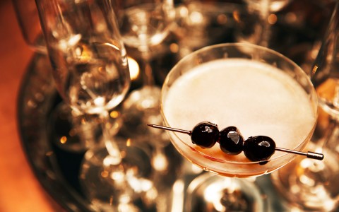 zoomed view of blueberry garnish on a cocktail