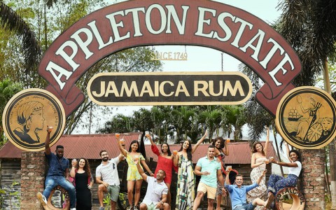 appleton estate jamaica rum entrance sign with people standing around it and posing for the picture