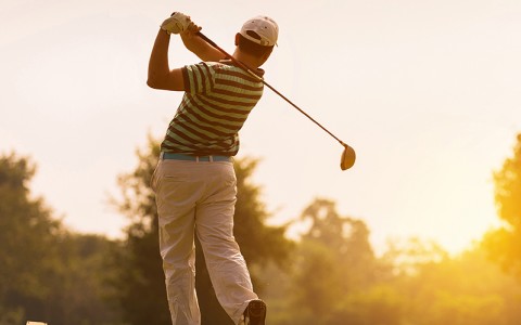 male golfer in golfer swing stance