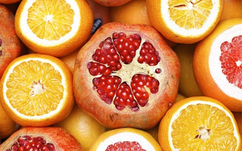 view of a pomegranate, oranges and grapefruit 