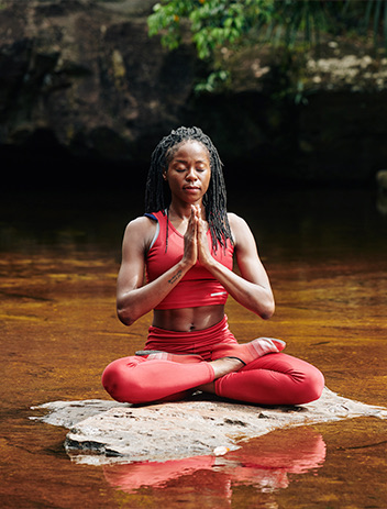 african american woman doing yoga outdoors