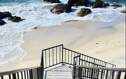 Staircase leading down to a beach