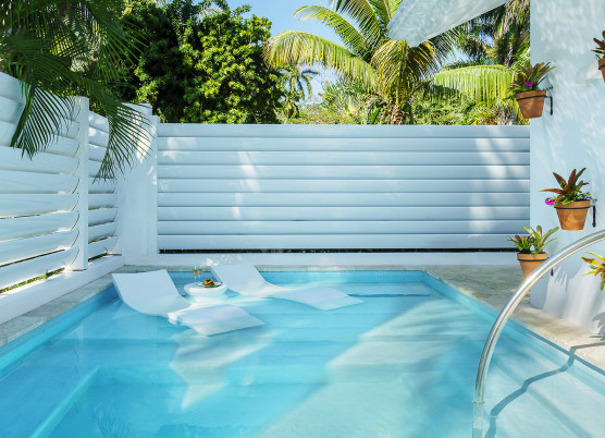 small private pool with two pool lounge chairs in the water