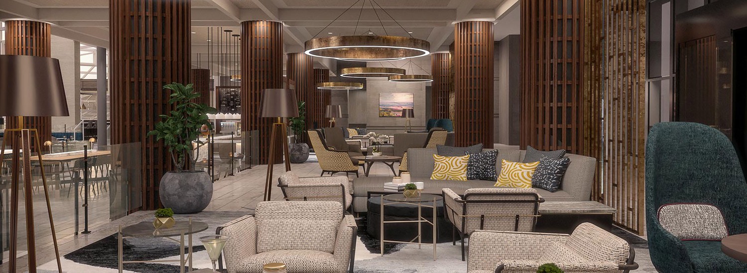 comfortable lobby seating area with chairs, couches, and modern circular light fixtures