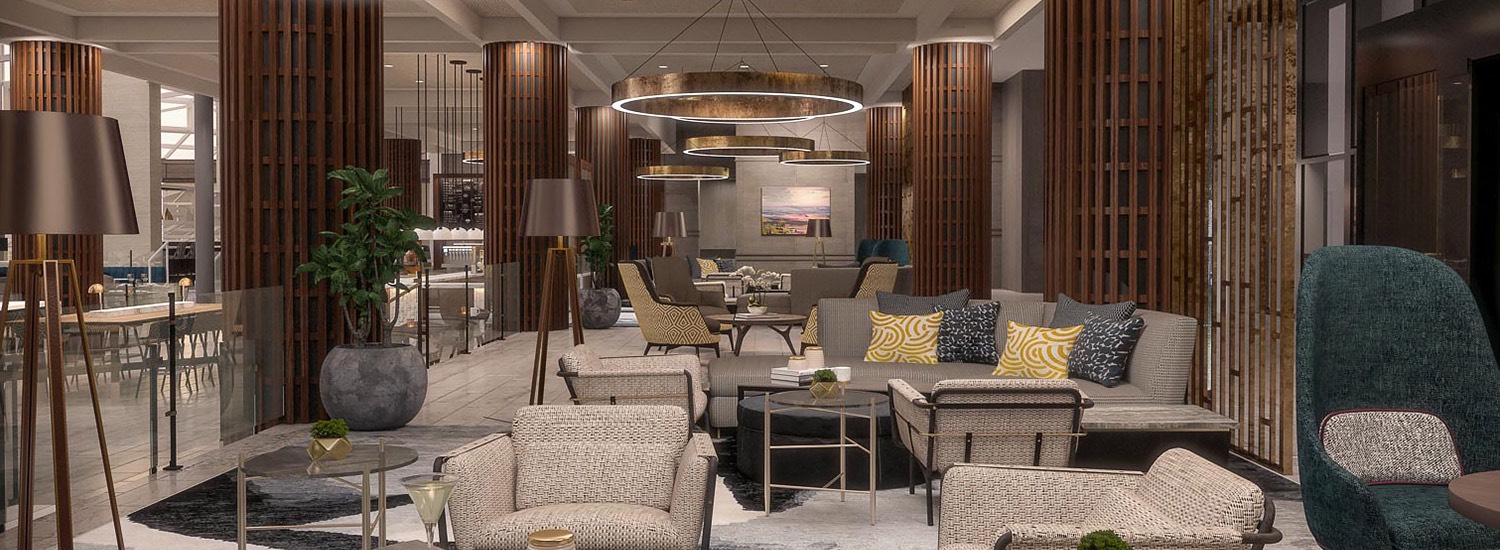 comfortable lobby seating area with chairs, couches, and modern circular light fixtures 