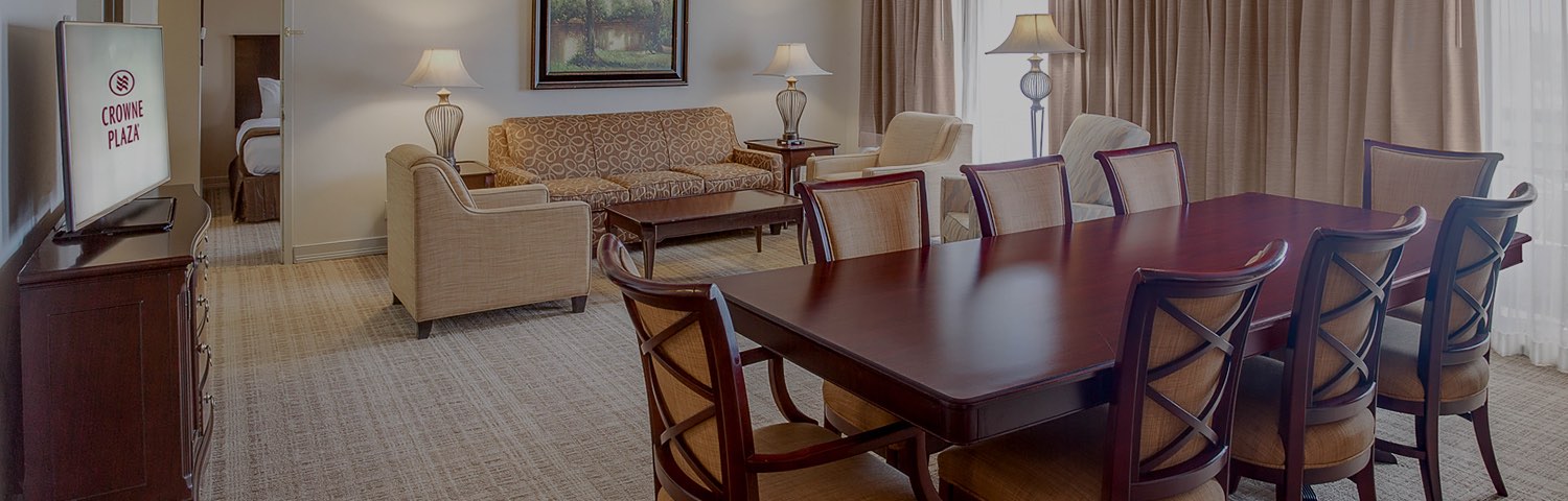 brown living room table sitting next to a living room setup