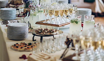 reasons restaurant tray of champagne glasses