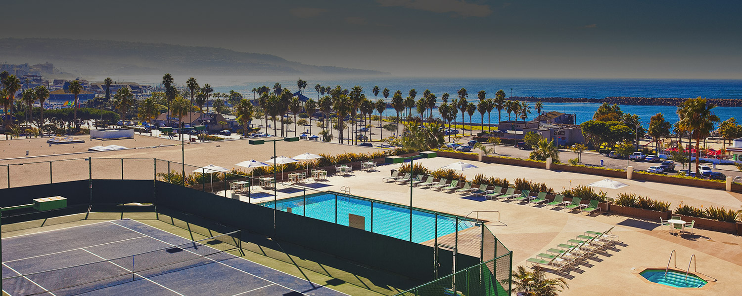 the pool deck and tennis courts