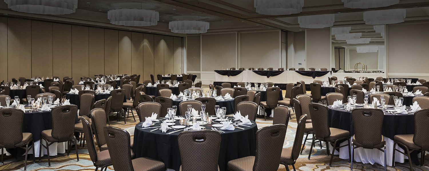 a ballroom set up for a dinner