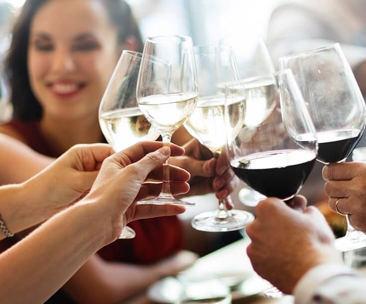 Group of people toasting with wine