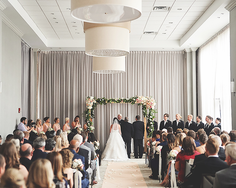 a large ballroom set up for a wedding ceremony