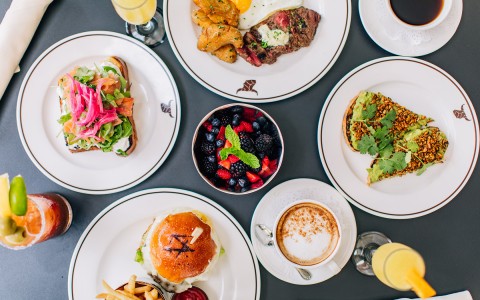 image of a table filled with plate options and cocktails