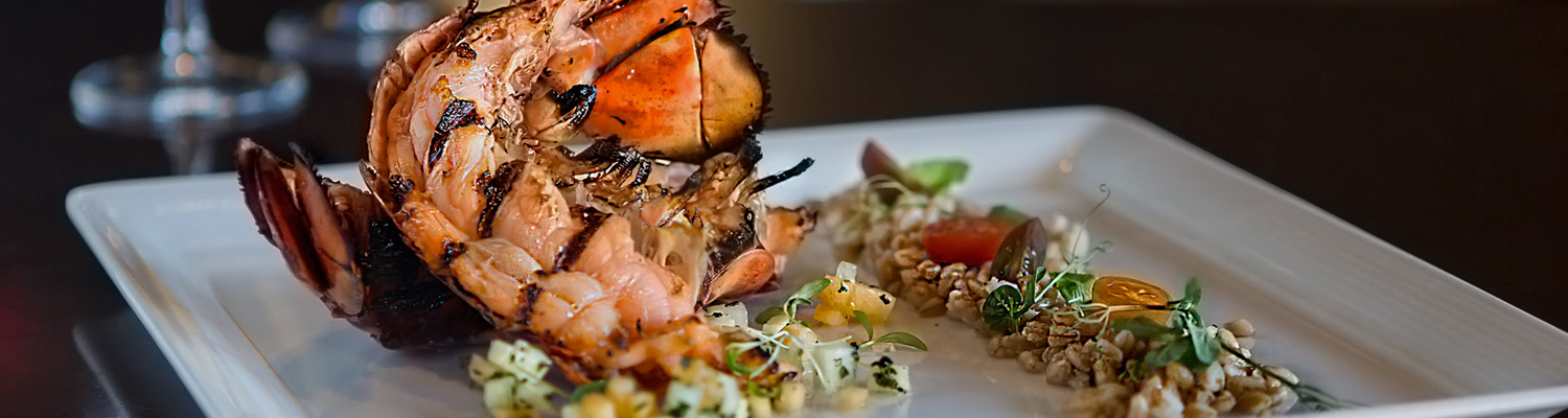 Grilled lobster on plate with rice