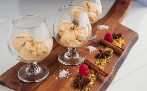 ice cream in wine glasses on wood board