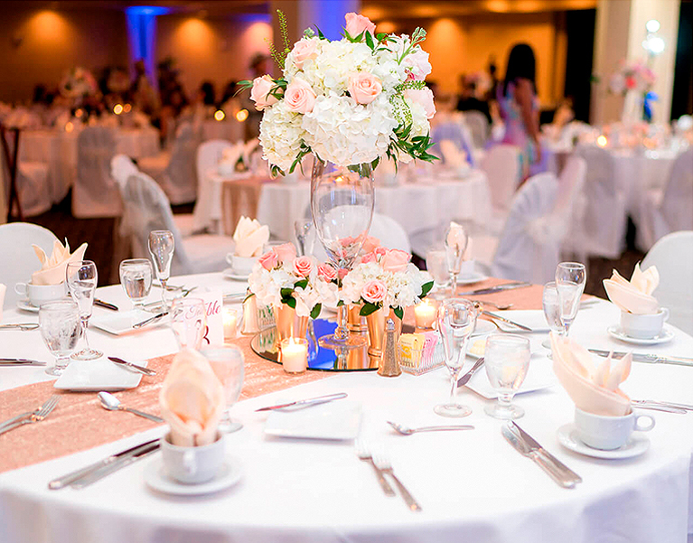 wedding table set up with pink accents