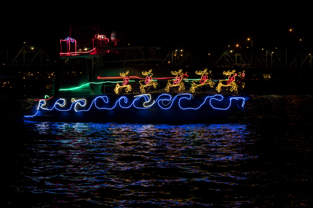 boat adorned with holiday lights