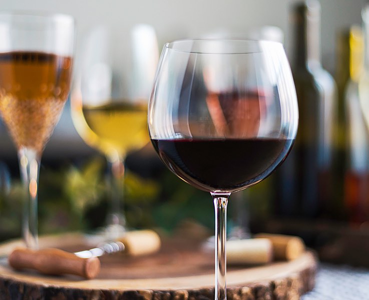 wine glasses with different samples of white and red wine