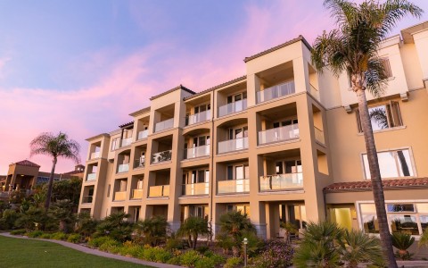 exterior of hotel building at sunset