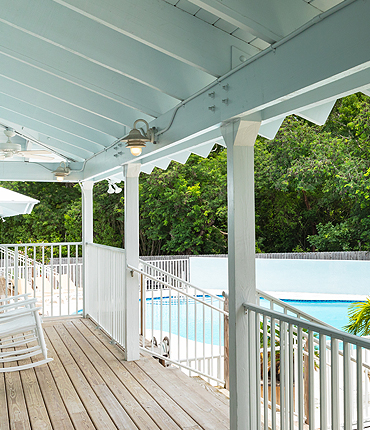 view of the pool area from a guest villa balcony