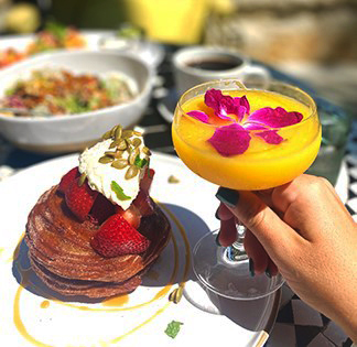 brunch dish with mimosa and flower in it 