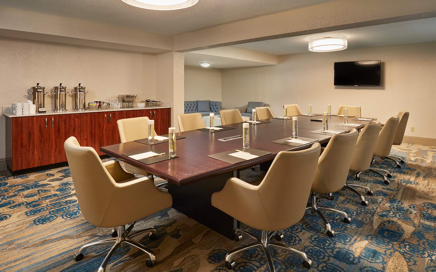 medium sized conference room with 12 comfy chairs