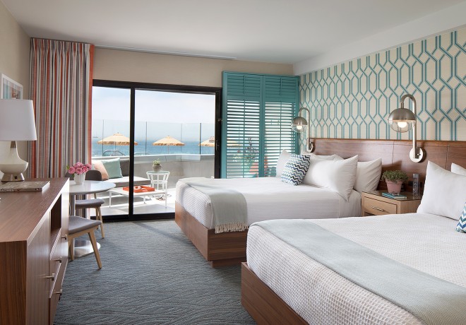 Double queen bedroom with ocean view balcony