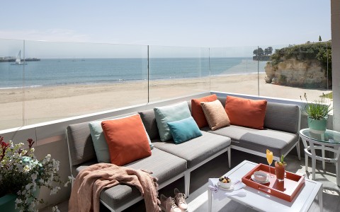 sectional couch on balcony with ocean views