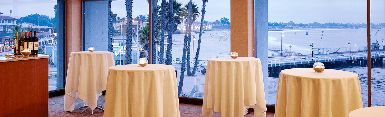 Event Space with four round tables at Dream Inn Santa Cruz