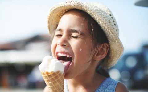 child eating ice cream cone