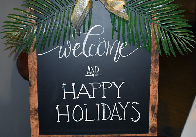 the-cove - a sign that says welcome and happy holidays