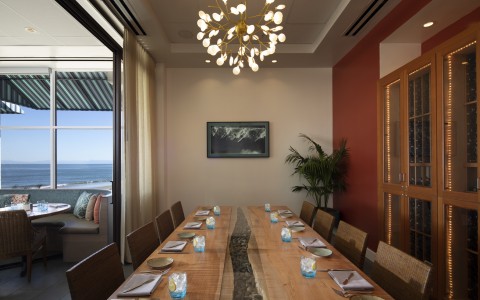 Private dining table with unique chandelier 
