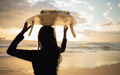 surfer holding board