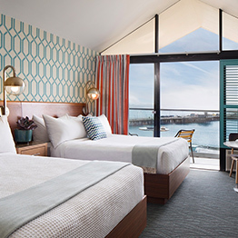 suite with double queen beds and balcony overlooking the ocean