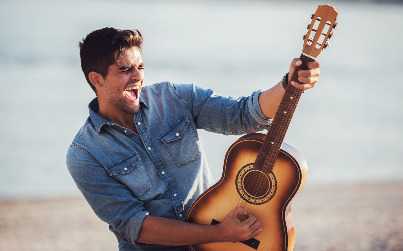 guy playing guitar outside