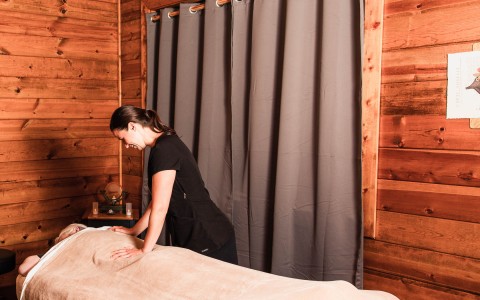 person getting a massage in a cabin