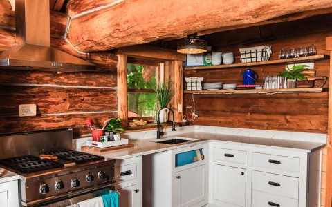 white kitchen with wooden backsplash 
