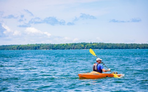 Man kayaking in the ocean